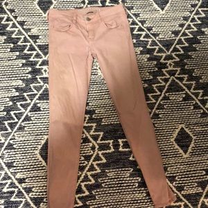 Pale pink skinny jeans